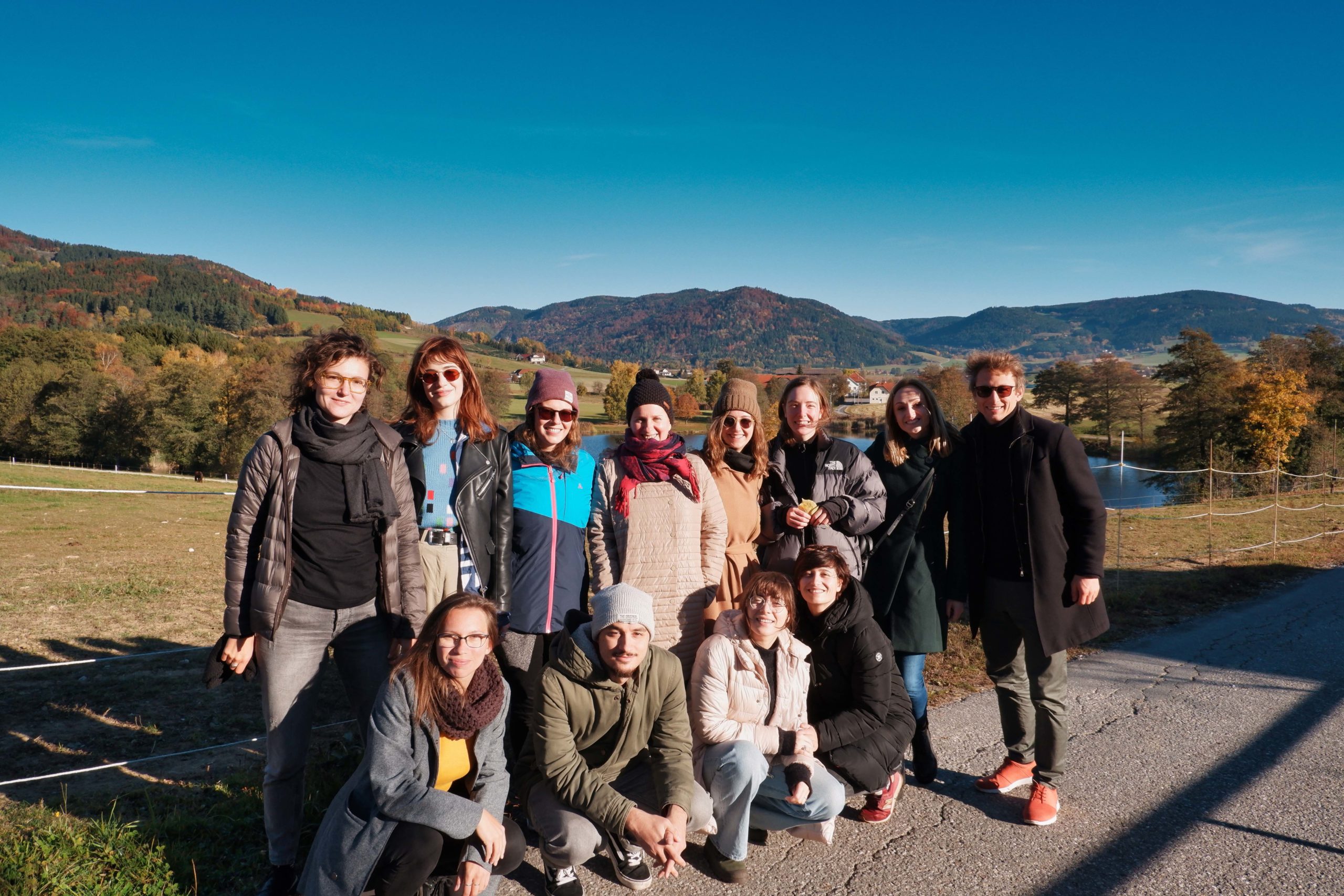 Jakob Detering, SIA coordinators and other members of the SIA international team smiling in front of a picturesque background.